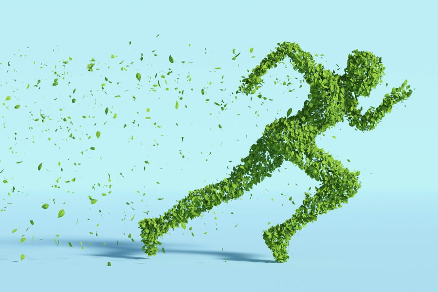 Menschliche Läuferfigur aus grünen Blättern